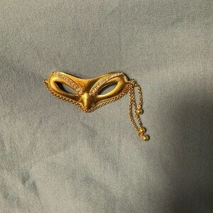 Gold Mask Brooch with Chain Accent